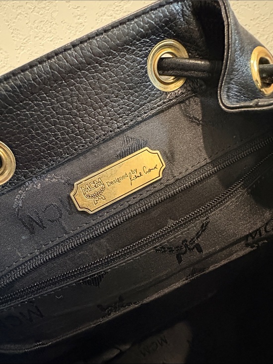 MCM Black Pebbled Leather Drawstring Backpack with Gold Accents main image 8